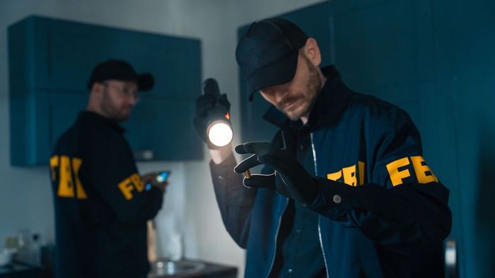 FBI agents meticulously examining a crime scene.
