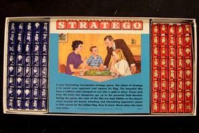Inside the Stratego box, the pieces are neatly arranged alongside an illustrated game guide from 1970.