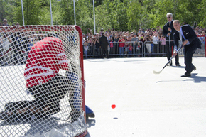 Prince William, Duke of Cambridge, takes a quick shot during a street hockey game in Yellowknife, Canada.