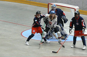 Street hockey games can be informal, yet wearing protective gear is always recommended.