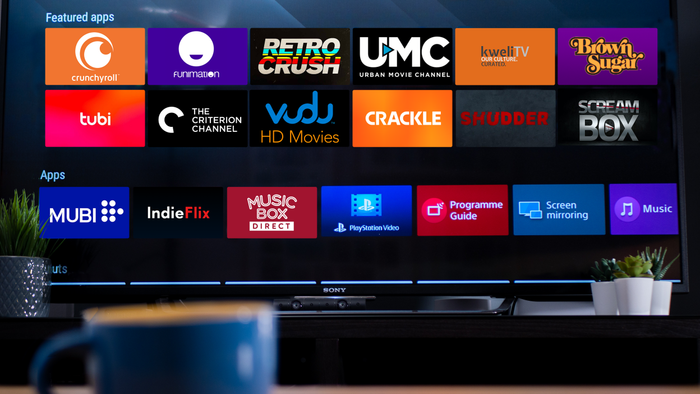 A television displaying various logos of streaming platforms
