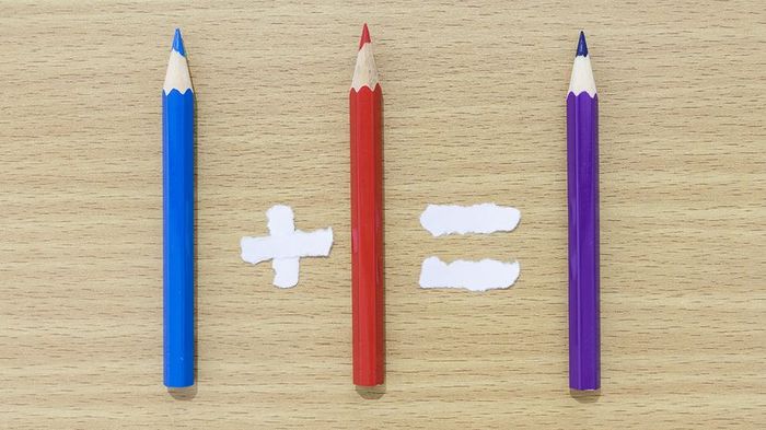 Colored pencils arranged to resemble a mathematical equation