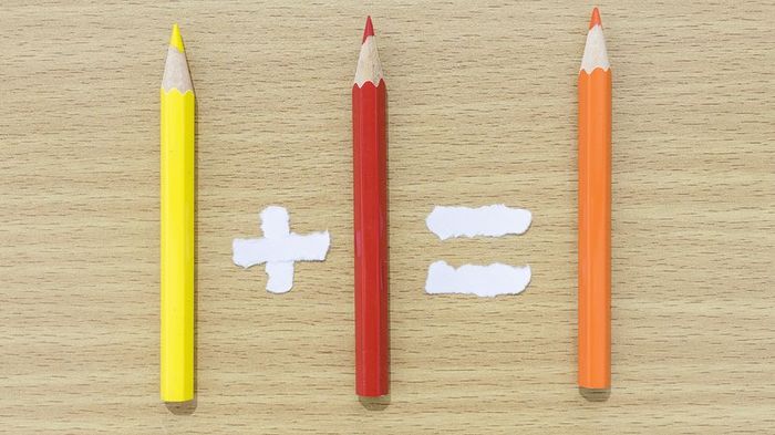 Colored pencils arranged to resemble a mathematical equation