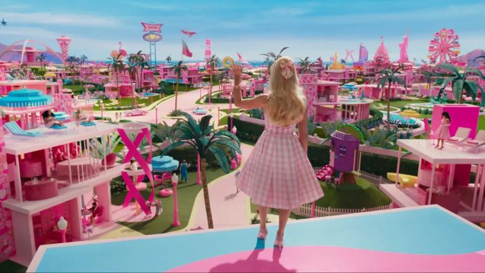 A promotional image from Barbie shows Barbie gazing over Barbieland
