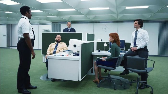 A photo showing the Severance cast in their office cubicles