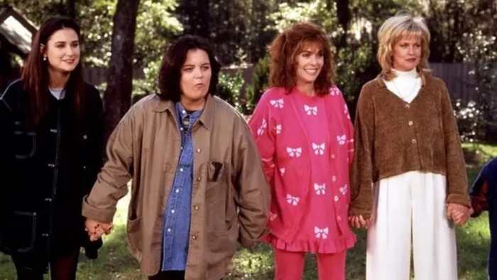 A still from Now and Then showing Demi Moore, Rosie O’Donnell, Rita Wilson, and Melanie Griffith portraying the grown-up versions of their characters