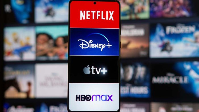 A smartphone displaying apps like Netflix, Disney+, Apple TV, and HBO Max.
