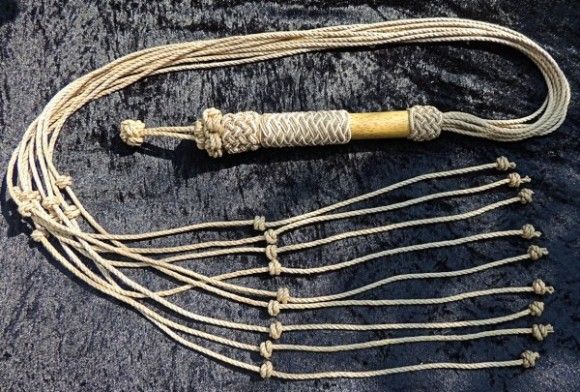 Known simply as 'the cat,' the cat o' nine tails is a terrifying instrument of torture. This multi-tailed whip can cause severe parallel wounds, and in some cases, metal balls with spikes are added to the ends of the cords, increasing the pain and brutality of the punishment.