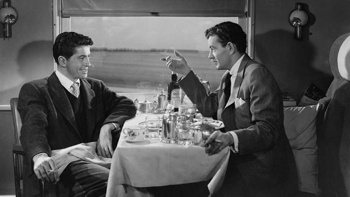 Two individuals met while traveling by train/Strangers on a Train