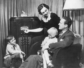 A household enjoys a radio broadcast together.