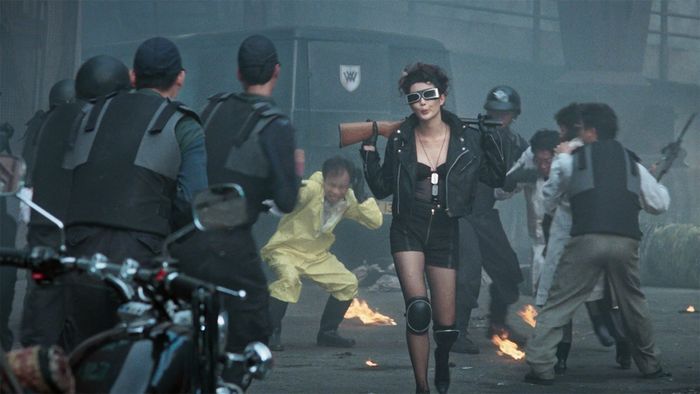 Maggie Cheung wielding a shotgun as Chat in The Heroic Trio