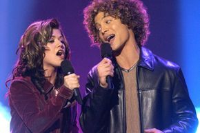 Justin Guarini and Kelly Clarkson, both from American Idol
