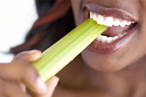A woman enjoying celery