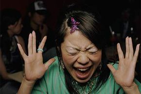flushed Asian woman