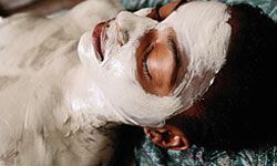woman receiving a body wrap treatment