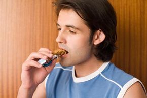 person enjoying an energy bar