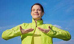 A woman engaging in yoga breathing exercises