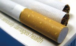 Cigarettes displayed on paper illustrating health risks
