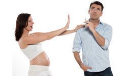 a pregnant woman in a heated discussion with a smoker