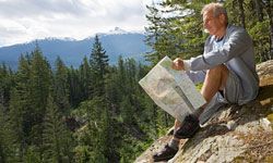 A retiree pauses during a scenic hiking adventure