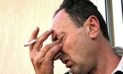 a stressed individual smoking