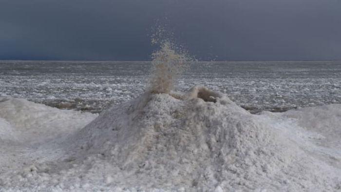A spectacular 'ice volcano' eruption captured along the shores of Lake Michigan.