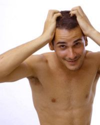 A frustrated shirtless man