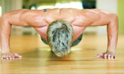 muscular man performing push-ups