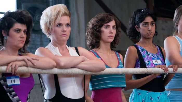 The women of GLOW stood proudly by the wrestling ring