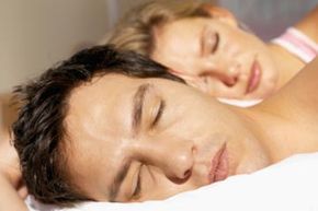 A couple resting in bed