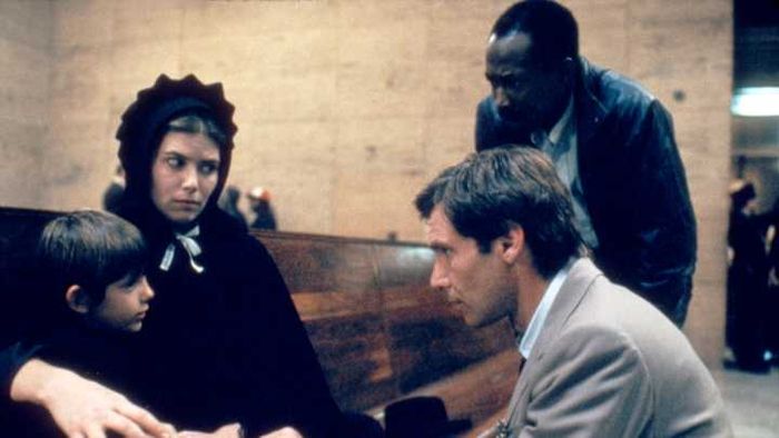 The cast of ‘Witness,’ including Lukas Haas, Kelly McGillis, Brent Jennings, and Harrison Ford.