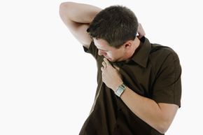 man inspecting underarm