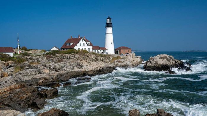 Portland Head Light and the rugged coastline of Portland, Maine, USA