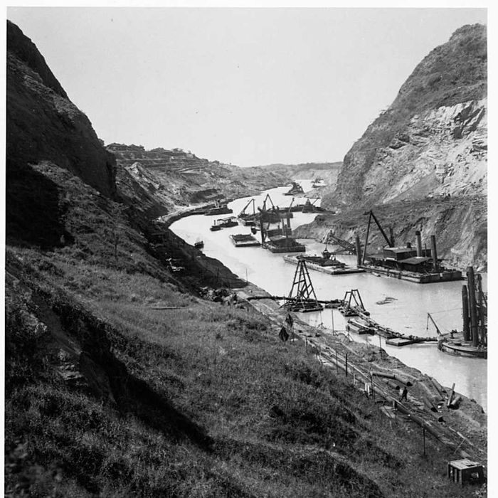Ships dredge the Gaillard (Culebra) Cut, Panama Canal.