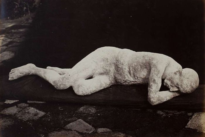 A plaster cast depicting a victim of the volcanic eruption that devastated Pompeii.
