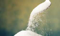 Pouring on the sugar.