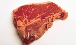 Horseradish serves as both a flavorful marinade and a zesty dipping sauce for premium beef cuts.