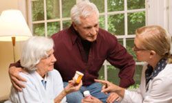 A couple discussing prescription medication with their doctor