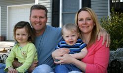a man enjoying life with his family and home