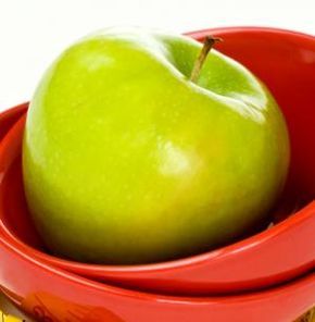 apple alongside a measuring tape