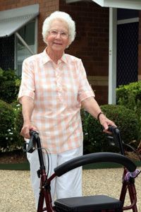 elderly woman using a walker
