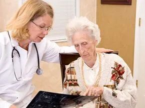 A patient discusses her medical care with her doctor.