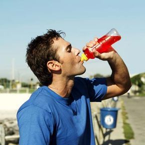 a man enjoying a refreshing sports drink