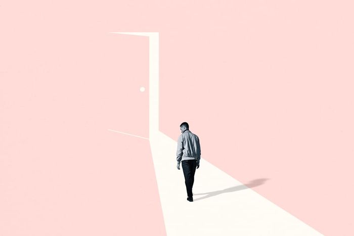 A photo illustration of a man walking toward an open door