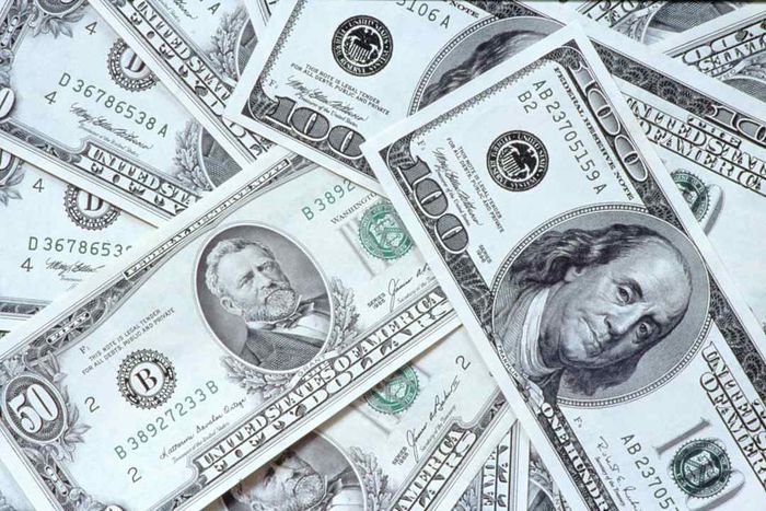 a stack of hundred- and fifty-dollar bills