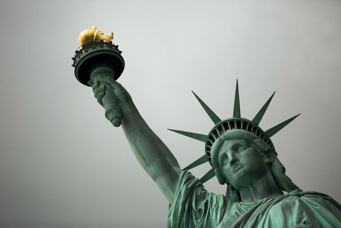 Symbols of Immigration: The Statue of Liberty and Ellis Island in NYC.