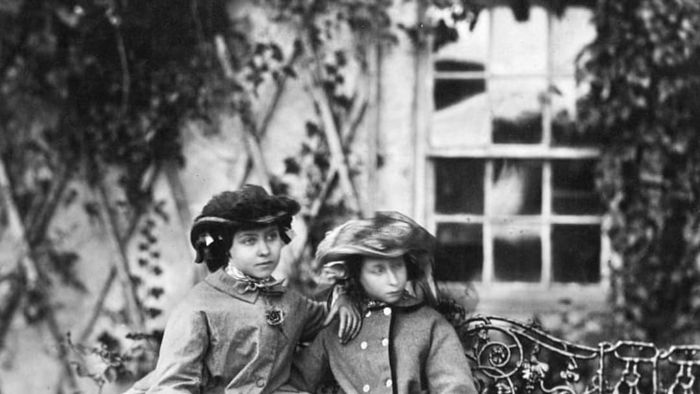 Princess Alice (right) is seated beside her sister Victoria.