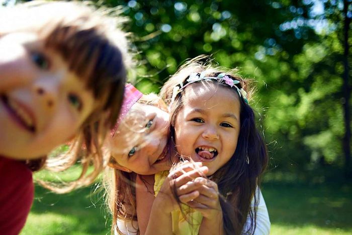 Girls smiling in a park