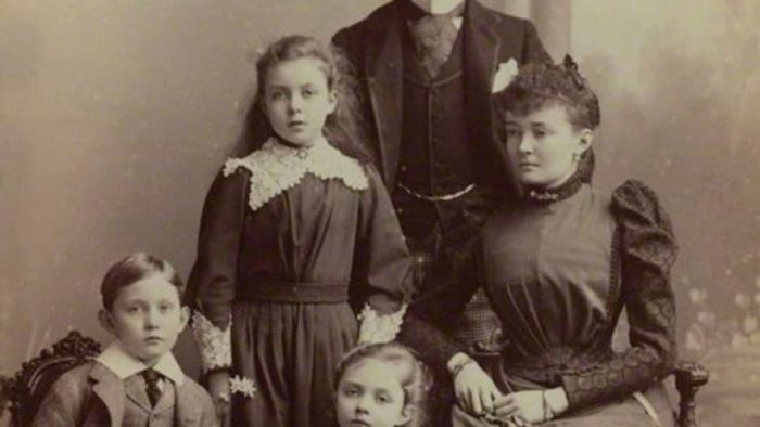Arthur pictured alongside his wife and children.