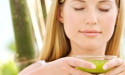 photo of a woman enjoying a cup of green tea